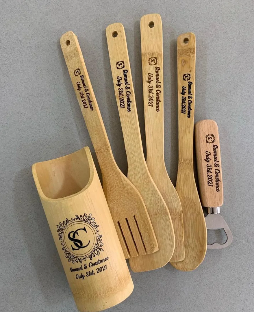 Bamboo utensil holder and matching spoons engraved with decorative wording