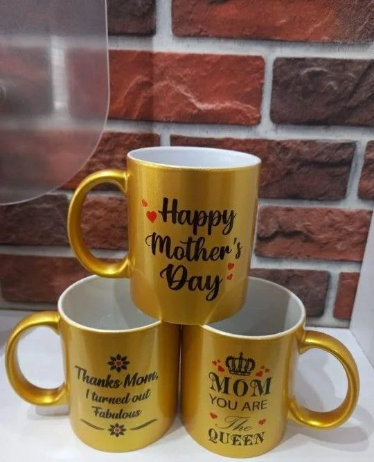 Three yellow mugs with black Mother’s Day messages