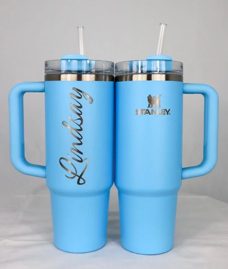 Two blue handled tumblers with engraved personalisation
